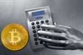 Calculator with bitcoin btc coin and futuristic hand