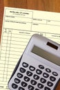 Calculator with a blank waybill Royalty Free Stock Photo