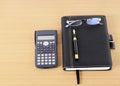 Calculator and Business book with Fountain pen and eyeglasses on Royalty Free Stock Photo