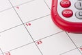 A red and silver calculator and calendar Royalty Free Stock Photo