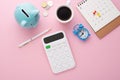 Calculator, calendar and piggy bank, top view Royalty Free Stock Photo