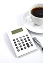 Calculator, coffee and pen