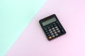 Calculator on color block background Royalty Free Stock Photo