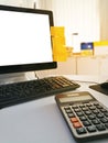 Calculator and computer PC are on the office desk.Communication network,social media,online shopping or Business management Royalty Free Stock Photo