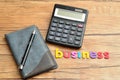 A calculator displayed with a notebook and a pen and the word business Royalty Free Stock Photo