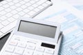 Calculator, document and keyboard on black table, closeup. Tax accounting Royalty Free Stock Photo