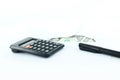 CALCULATOR WITH DOLLAR BILLS AND PEN Royalty Free Stock Photo