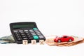 Calculator, euro money and red car. Wooden cubes with word tax. Red car and euro banknotes. Copy space for text. Tax and money pay