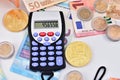 calculator euro notes and coins and virtual money Royalty Free Stock Photo