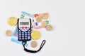 calculator euro notes and coins and virtual money Royalty Free Stock Photo