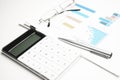 Calculator on financial statement and balance sheeet on desk of auditor. Concept of accounting and audit business Royalty Free Stock Photo