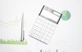 Calculator on financial statement and balance sheeet on desk of auditor. Concept of accounting and audit business Royalty Free Stock Photo