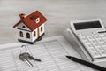 Calculator, house model, keys and documents. Real estate agent`s workplace Royalty Free Stock Photo