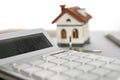 Calculator, house model and keys. Real estate agent`s workplace Royalty Free Stock Photo