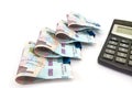 Calculator and 1000 hryvnia fastened by a clip on white Royalty Free Stock Photo
