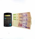 Calculator and hundred Argentine pesos Royalty Free Stock Photo