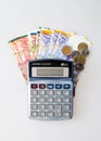 Calculator, Israeli Shekel Notes And coins isolated on white Royalty Free Stock Photo
