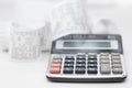 Calculator with many receipts for calculating family budgets Royalty Free Stock Photo