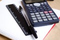 Calculator. Maths. School calculations. Two and four. Bugtery Notebook. Office to work in the office. School supplies. Pens, penci Royalty Free Stock Photo