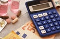 Calculator, medicines and euro bills Royalty Free Stock Photo