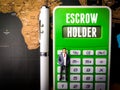 Calculator,miniature people and pen with text ESCROW HOLDER