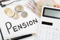 Calculator, money, clipboard with paper sheet and pen, top view. Pension concept Royalty Free Stock Photo