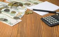 Home savings, budget concept. Calculator, pen, notepad and money on wooden office desk table. Royalty Free Stock Photo