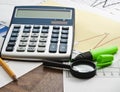 Calculator on paper table with diagram Royalty Free Stock Photo