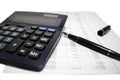 Calculator and pen on balance sheet