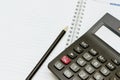 Calculator and pen on blank notebook Royalty Free Stock Photo