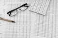 Calculator,pen and eye glasses on financial documents. Top view Royalty Free Stock Photo