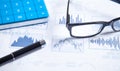 Calculator, pen, eyeglasses on financial graphs. Business. Analysis Royalty Free Stock Photo