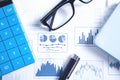Calculator, pen, eyeglasses on financial graphs. Business. Analysis Royalty Free Stock Photo