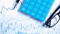 Calculator, pen, eyeglasses on financial graphs. Business. Analysis Royalty Free Stock Photo