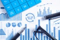 Calculator, pen, eyeglasses on financial graphs. Business. Analysis Royalty Free Stock Photo