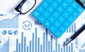 Calculator, pen, eyeglasses on financial graphs. Business. Analysis Royalty Free Stock Photo