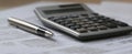 The calculator and pen on financial documents for business analysis..AI generated image Royalty Free Stock Photo
