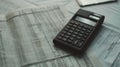 A calculator and pen rest on a financial document with numbers..AI generated image Royalty Free Stock Photo