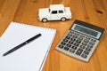 Calculator, a pen and a toy car Royalty Free Stock Photo