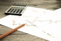 Calculator and pencil on graffica the Dow Jones on forex market Royalty Free Stock Photo