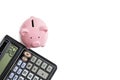 Calculator and piggy bank white background.Concept family budget and business Royalty Free Stock Photo