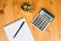 Calculator With Piggybank and a notepad Royalty Free Stock Photo