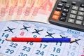 Calculator, red and blue pencil and banknotes of five thousand r Royalty Free Stock Photo