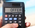 Calculator text OFFER on display. Tourism business concept