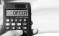 Calculator text OFFER on display. Tourism business concept