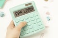 Calculator with text PPP LOAN on dollars. Business Royalty Free Stock Photo