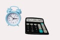 Calculator with text Self Employed on a white background with a clock Royalty Free Stock Photo