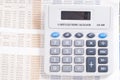 Calculator on top of newspaper Royalty Free Stock Photo