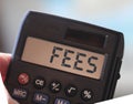 Calculator with the word FEES on the display. Taxes business concept Royalty Free Stock Photo