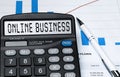 Calculator with the word ONLINE BUSINESS on the display Royalty Free Stock Photo